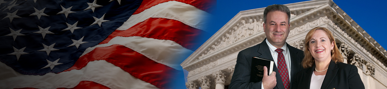 Attorneys with the US flag and courthouse at the background